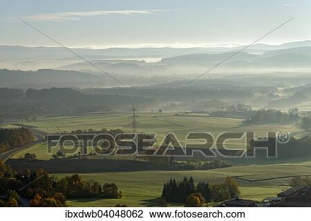 Stock Image - "View from the Parkstein over the Naabtal valley and the Weidener Becken basin to the east, Upper Palatinate, Bavaria, Germany, Europe". Fotosearch