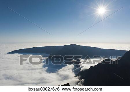 "View from the summit, bright sun, Piton des Neiges Mountain, 3069 m, above the clouds, near Cilaos, Reunion" View Large Photo Image Stock Photograph - "View from the summit, bright sun, Piton des Neiges Mountain, 3069 m, above the clouds, near Cilaos, Reunion". Fotosearch