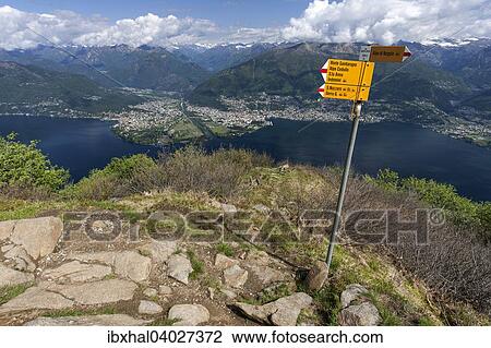 "View from the trail at Monte Gambarogno on Lago Maggiore, Ticino Alps, Ascona and Locarno, Canton of Ticino, Switzerland, Europe" View Large Photo Image Stock Image - "View from the trail at Monte Gambarogno on Lago Maggiore, Ticino Alps, Ascona and Locarno, Canton of Ticino, Switzerland, Europe". Fotosearch