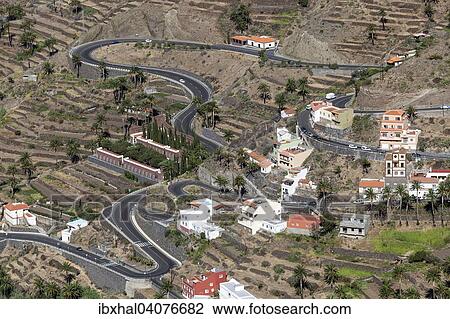 Stock Image - "View from the trail between Valle Gran Rey and El Cercado on terraced fields, road and Lomo del Balo in the upper Valle Gran Rey, La Gomera, Canary Islands, Spain, Europe". Fotosearch