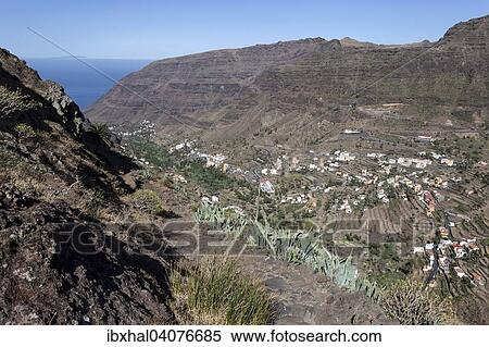 "View from the trail between Valle Gran Rey and El Cercado on terraced fields and villages in Valle Gran Rey, La Gomera, Canary Islands, Spain, Europe" View Large Photo Image Stock Photography - "View from the trail between Valle Gran Rey and El Cercado on terraced fields and villages in Valle Gran Rey, La Gomera, Canary Islands, Spain, Europe". Fotosearch