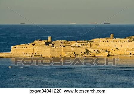 Stock Image - "View from Valletta to Ricasoli Fortress on a headland at the Grand Harbour, Kalkara, Malta, Europe". Fotosearch