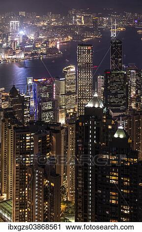Stock Image - "View from Victoria Peak across the high-rise buildings at night, Central District, Hong Kong, China, Asia". Fotosearch