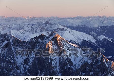 "View from Zugspitze Mountain over Hochwanner Mountain, 2744m asl, in the evening light, Wetterstein Mountains, Upper Bavaria, Bavaria, Germany, Europe" View Large Photo Image Stock Photo - "View from Zugspitze Mountain over Hochwanner Mountain, 2744m asl, in the evening light, Wetterstein Mountains, Upper Bavaria, Bavaria, Germany, Europe". Fotosearch