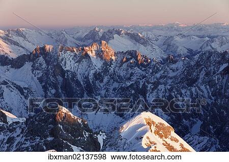 "View from Zugspitze Mountain over the Hoellentalspitzen Mountains and Dreitorspitze Mountain in the evening light, Wetterstein Mountains, Upper Bavaria, Bavaria, Germany, Europe" View Large Photo Image Stock Photo - "View from Zugspitze Mountain over the Hoellentalspitzen Mountains and Dreitorspitze Mountain in the evening light, Wetterstein Mountains, Upper Bavaria, Bavaria, Germany, Europe". Fotosearch