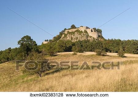 Stock Photo - "View of a rough pasture with the Hegau volcano and the Hohentwiel ruins, Baden-Wuerttemberg, Germany, Europe". Fotosearch