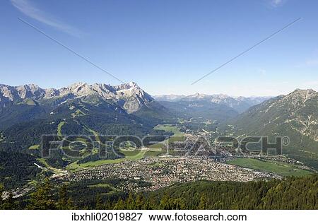 Stock Photo - "View of Garmisch-Partenkirchen, Zugspitze mountain, Jubilaeumsgrat ridge and Alpspitze mountain as seen from Wank mountain, Upper Bavaria, Bavaria, Germany, Europe". Fotosearch