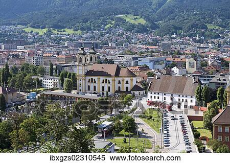 Stock Photography - "View of Innsbruck, Wiltern district with the Wilten Basilica, Wilten Abbey and cemetery, capital of Tyrol, Northern Chain, Alps, Austria, Europe, PublicGround, Europe". Fotosearch