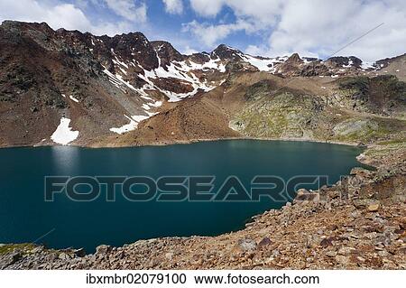 "View of Lago Verde lake at the descent of Mt Zufrittspitze in Ulten Valley or Val d'Ultimo, above the Lago di Fontana Bianca lake, Mt Hintere Eggenspitze or Cima Sternai with the Vedretta Fontana Bianca glacier in the back, South Tyrol, Italy, Europe" View Large Photo Image Stock Image - "View of Lago Verde lake at the descent of Mt Zufrittspitze in Ulten Valley or Val d'Ultimo, above the Lago di Fontana Bianca lake, Mt Hintere Eggenspitze or Cima Sternai with the Vedretta Fontana Bianca glacier in the back, South Tyrol, Italy, Europe". Fotosearch