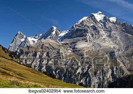 "View of Mt. Eiger, Mt. Moench and Mt. Jungfrau, from left to right; UNESCO World Heritage Site Jungfrau-Aletsch protected area, Muerren, Bernese Oberland, Switzerland, Europe" View Large Photo Image Picture - "View of Mt. Eiger, Mt. Moench and Mt. Jungfrau, from left to right; UNESCO World Heritage Site Jungfrau-Aletsch protected area, Muerren, Bernese Oberland, Switzerland, Europe". Fotosearch