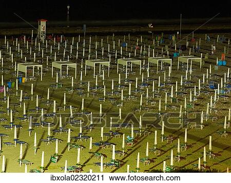 "View of the beach at night with closed parasols and sun loungers, Lignano Sabbiadoro, Udine, Adriatic Coast, Italy, Europe" View Large Photo Image Stock Image - "View of the beach at night with closed parasols and sun loungers, Lignano Sabbiadoro, Udine, Adriatic Coast, Italy, Europe". Fotosearch