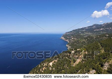 "View of the cliffs with a remote house near Estellencs, Serra de Tramuntana, Northwestern Coast, Mallorca, Balearic Islands, Mediterranean Sea, Spain, Europe" View Large Photo Image Stock Photography - "View of the cliffs with a remote house near Estellencs, Serra de Tramuntana, Northwestern Coast, Mallorca, Balearic Islands, Mediterranean Sea, Spain, Europe". Fotosearch