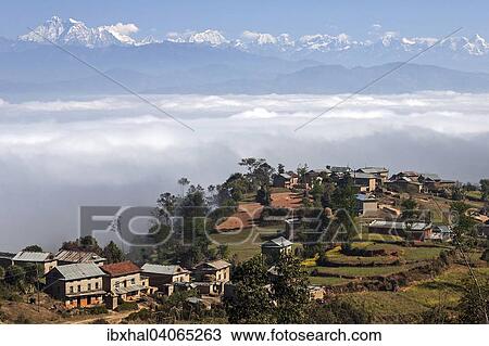 "View of the countryside, rural houses, terraced fields and mountains of the Himalayas, fog in the valley, near Dhulikel, Nepal, Asia" View Large Photo Image Stock Image - "View of the countryside, rural houses, terraced fields and mountains of the Himalayas, fog in the valley, near Dhulikel, Nepal, Asia". Fotosearch