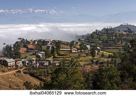 "View of the countryside, rural houses, terraced fields and mountains of the Himalayas, fog in the valley, near Dhulikel, Nepal, Asia" View Large Photo Image Stock Photo - "View of the countryside, rural houses, terraced fields and mountains of the Himalayas, fog in the valley, near Dhulikel, Nepal, Asia". Fotosearch