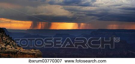 Stock Photo - "View of the Grand Canyon at sunset with storm clouds, viewing point Mather Point, South Rim, Grand Canyon, at Tusayan, Arizona, USA". Fotosearch