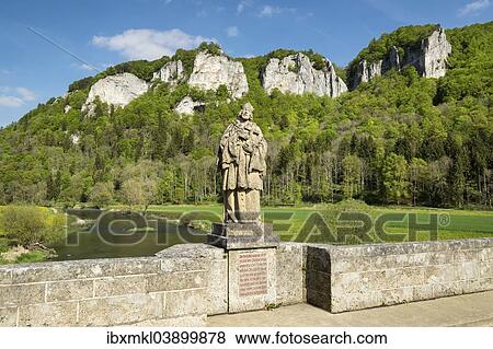 "View of the Hausener Zinnen peaks and the statue of St. Nepomuk seen from Hausener Brucke bridge, Hausen im Tal, Upper Danube Valley, Baden-Wurttemberg, Germany, Europe" View Large Photo Image Stock Photo - "View of the Hausener Zinnen peaks and the statue of St. Nepomuk seen from Hausener Brucke bridge, Hausen im Tal, Upper Danube Valley, Baden-Wurttemberg, Germany, Europe". Fotosearch