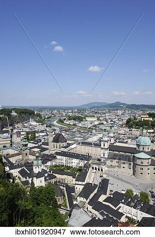 Stock Photo - "View of the historic district of Salzburg as seen from Hohensalzburg Castle, Kapitelplatz square and Salzburg Cathedral in the front, Austria, Europe". Fotosearch