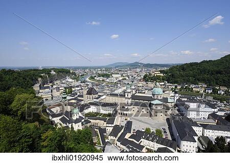 "View of the historic district of Salzburg as seen from Hohensalzburg Castle, Kapitelplatz square and Salzburg Cathedral in the front, Austria, Europe" View Large Photo Image Stock Photography - "View of the historic district of Salzburg as seen from Hohensalzburg Castle, Kapitelplatz square and Salzburg Cathedral in the front, Austria, Europe". Fotosearch