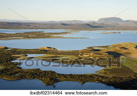 "View of the Hverfell or Hverfjall crater as seen from Vindbelgjarfjall mountain, Burfell mountain, Lake Myvatn and a pseudo-crater, Norourland eystra region, or north-east region, Iceland, Europe" View Large Photo Image Picture - "View of the Hverfell or Hverfjall crater as seen from Vindbelgjarfjall mountain, Burfell mountain, Lake Myvatn and a pseudo-crater, Norourland eystra region, or north-east region, Iceland, Europe". Fotosearch