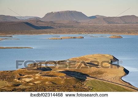 Stock Photo - "View of the Hverfell or Hverfjall crater as seen from Vindbelgjarfjall mountain, Burfell mountain, Lake Myvatn and a pseudo-crater, Norourland eystra region, or north-east region, Iceland, Europe". Fotosearch