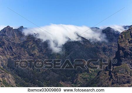 "View of the mountains and deep gorges seen from Pico dos Barcelos mountain, Funchal Pico dos Barcelos, Curral das Freiras, Ilha da Madeira, Portugal, Europe" View Large Photo Image Stock Photo - "View of the mountains and deep gorges seen from Pico dos Barcelos mountain, Funchal Pico dos Barcelos, Curral das Freiras, Ilha da Madeira, Portugal, Europe". Fotosearch