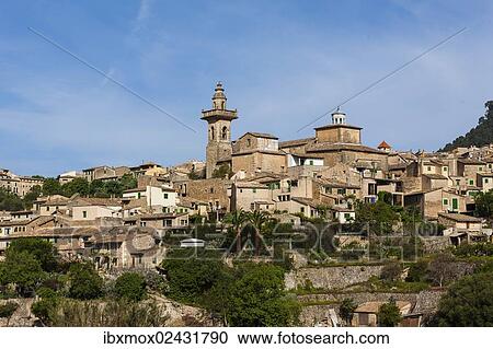 "View of the old town of Valldemossa with the parish church of Sant Bartomeu, Serra de Tramuntana, Northwestern Coast, Mallorca, Majorca, Balearic Islands, Spain, Europe" View Large Photo Image Stock Image - "View of the old town of Valldemossa with the parish church of Sant Bartomeu, Serra de Tramuntana, Northwestern Coast, Mallorca, Majorca, Balearic Islands, Spain, Europe". Fotosearch