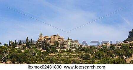 "View of the old town of Valldemossa with the parish church of Sant Bartomeu, Serra de Tramuntana, Northwestern Coast, Mallorca, Majorca, Balearic Islands, Spain, Europe" View Large Photo Image Stock Image - "View of the old town of Valldemossa with the parish church of Sant Bartomeu, Serra de Tramuntana, Northwestern Coast, Mallorca, Majorca, Balearic Islands, Spain, Europe". Fotosearch