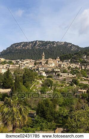 "View of the old town of Valldemossa with the parish church of Sant Bartomeu, Serra de Tramuntana, Northwestern Coast, Mallorca, Majorca, Balearic Islands, Spain, Europe" View Large Photo Image Stock Photography - "View of the old town of Valldemossa with the parish church of Sant Bartomeu, Serra de Tramuntana, Northwestern Coast, Mallorca, Majorca, Balearic Islands, Spain, Europe". Fotosearch