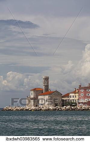 "View of the town of Piran with lighthouse and the Church of Our Lady of Health, St. Clement Church, Piran, Istria, Slovenia, Europe" View Large Photo Image Stock Photography - "View of the town of Piran with lighthouse and the Church of Our Lady of Health, St. Clement Church, Piran, Istria, Slovenia, Europe". Fotosearch