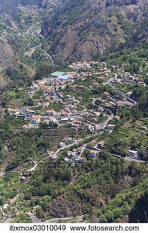 "View of the village of Curral das Freiras seen from Pico dos Barcelos mountain, with its deep gorges, Funchal Pico dos Barcelos, Curral das Freiras, Ilha da Madeira, Portugal, Europe" View Large Photo Image Stock Photo - "View of the village of Curral das Freiras seen from Pico dos Barcelos mountain, with its deep gorges, Funchal Pico dos Barcelos, Curral das Freiras, Ilha da Madeira, Portugal, Europe". Fotosearch