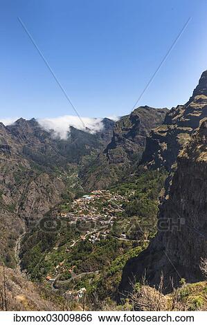 "View of the village of Curral das Freiras seen from Pico dos Barcelos mountain, with its deep gorges, Curral das Freiras, Funchal, Madeira, Portugal, Europe" View Large Photo Image Stock Photograph - "View of the village of Curral das Freiras seen from Pico dos Barcelos mountain, with its deep gorges, Curral das Freiras, Funchal, Madeira, Portugal, Europe". Fotosearch
