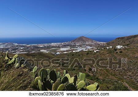 Stock Photograph - "View of the village of Galdar de Sardina and Mount Pico de Galdar, Galdar, Gran Canaria, Canary Islands, Spain, Europe, PublicGround, Europe". Fotosearch