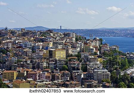 Stock Image - "View over the rooftops of Besiktas and Beyoglu towards the Bosphorus, as seen from the Galata Tower, Kuelesi, Istanbul, Turkey, Asia". Fotosearch