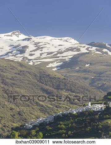 "View over the town of Pampaneira towards the snow-capped Sierra Nevada Mountains, Pampaneira, Andalucia, Spain, Europe" View Large Photo Image Stock Image - "View over the town of Pampaneira towards the snow-capped Sierra Nevada Mountains, Pampaneira, Andalucia, Spain, Europe". Fotosearch