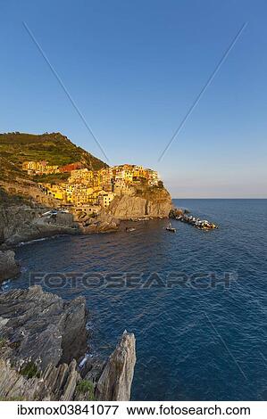 Stock Photo - "Village with colourful houses by the sea, Manarola, Cinque Terre, UNESCO World Heritage Site, Province of La Spezia, Liguria, Italy, Europe". Fotosearch