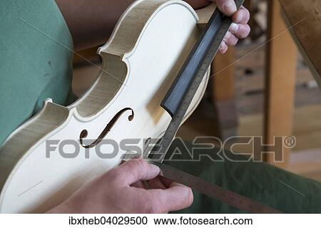 "Violin making, attaching the neck" View Large Photo Image Stock Image - "Violin making, attaching the neck". Fotosearch