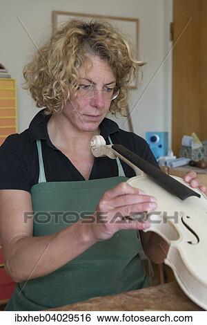 "Violin making, attaching the neck, control" View Large Photo Image Stock Photograph - "Violin making, attaching the neck, control". Fotosearch