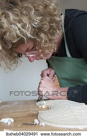 Stock Image - "Violin making, cutting the liner". Fotosearch