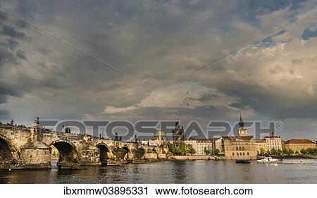 Stock Image - "Vltava river with Charles Bridge or Karluv most, UNESCO World Heritage Site, evening atmosphere, Prague, Czech Republic, Europe". Fotosearch