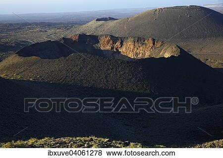 "Volcanic crater in Timanfaya National Park, Montanas del Fuego, Fire Mountains, in the evening light, volcanic landscape, Lanzarote, Canary Islands, Spain, Europe" View Large Photo Image Stock Photo - "Volcanic crater in Timanfaya National Park, Montanas del Fuego, Fire Mountains, in the evening light, volcanic landscape, Lanzarote, Canary Islands, Spain, Europe". Fotosearch