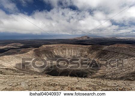 "Volcanic landscape, Fire Mountains, volcanoes, crater of the Caldera Blanca volcano, Lanzarote, Canary Islands, Spain, Europe" View Large Photo Image Stock Photo - "Volcanic landscape, Fire Mountains, volcanoes, crater of the Caldera Blanca volcano, Lanzarote, Canary Islands, Spain, Europe". Fotosearch