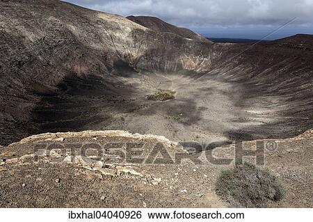 "Volcanic landscape, Fire Mountains, volcanoes, crater of the Caldera Blanca volcano, Lanzarote, Canary Islands, Spain, Europe" View Large Photo Image Stock Photograph - "Volcanic landscape, Fire Mountains, volcanoes, crater of the Caldera Blanca volcano, Lanzarote, Canary Islands, Spain, Europe". Fotosearch