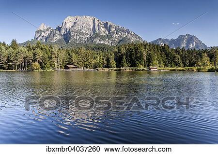 "Volser Weiher lake area in the Alpe di Siusi holiday region, behind the Sciliar, Dolomites, Province of South Tyrol, Italy, Europe" View Large Photo Image Stock Image - "Volser Weiher lake area in the Alpe di Siusi holiday region, behind the Sciliar, Dolomites, Province of South Tyrol, Italy, Europe". Fotosearch