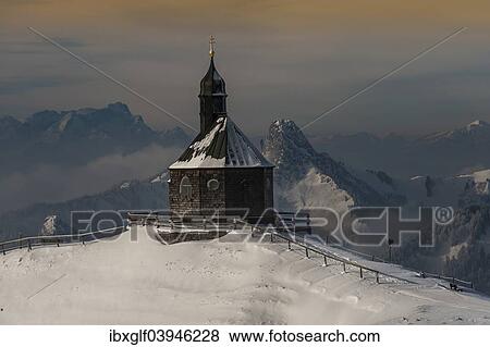 "Wallbergkircherl on Mt. Wallenberg in winter, rear left Zugspitze, and Rossstein and Buchstein right, Upper Bavaria, Bavaria, Germany, Europe" View Large Photo Image Stock Photo - "Wallbergkircherl on Mt. Wallenberg in winter, rear left Zugspitze, and Rossstein and Buchstein right, Upper Bavaria, Bavaria, Germany, Europe". Fotosearch