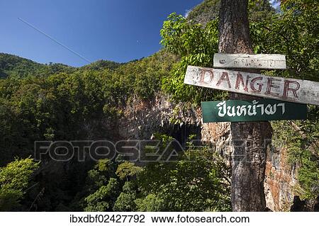 "Warning sign, lettering """"Danger"""", Spirit Well cave, also known as Nam Bua Phi, jungle, bamboo forest, Soppong or Pang Mapha area, Mae Hong Son province, northern Thailand, Thailand, Asia" View Large Photo Image Stock Image - "Warning sign, lettering """"Danger"""", Spirit Well cave, also known as Nam Bua Phi, jungle, bamboo forest, Soppong or Pang Mapha area, Mae Hong Son province, northern Thailand, Thailand, Asia". Fotosearch