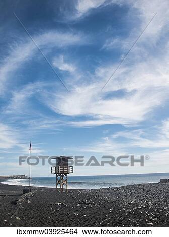Picture - "Watch tower on the beach, red flag, Tazacorte, La Palma, Canary Islands, Spain, Europe". Fotosearch