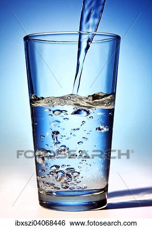 Stock Photograph - Water is poured into a glass. Fotosearch