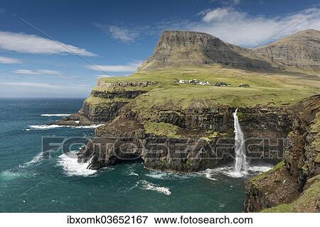 "Waterfall on the cliffs near a village, Gasadalur, Vagar, Faroe Islands, Denmark, Europe" View Large Photo Image Stock Photo - "Waterfall on the cliffs near a village, Gasadalur, Vagar, Faroe Islands, Denmark, Europe". Fotosearch