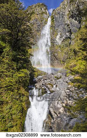 "Waterfall with a rainbow on Arthur's Pass, South Island, New Zealand, Oceania" View Large Photo Image Stock Photo - "Waterfall with a rainbow on Arthur's Pass, South Island, New Zealand, Oceania". Fotosearch