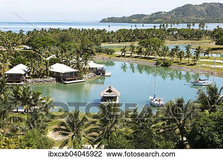 "Waterfront bungalows, South Seas, Plantation Island or Malolo Lailai, Mamanuca Islands, Fiji, Oceania" View Large Photo Image Stock Image - "Waterfront bungalows, South Seas, Plantation Island or Malolo Lailai, Mamanuca Islands, Fiji, Oceania". Fotosearch